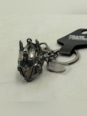 Universal Studios Transformers Optimus Prime Helmet Keychain with Blue Eyes